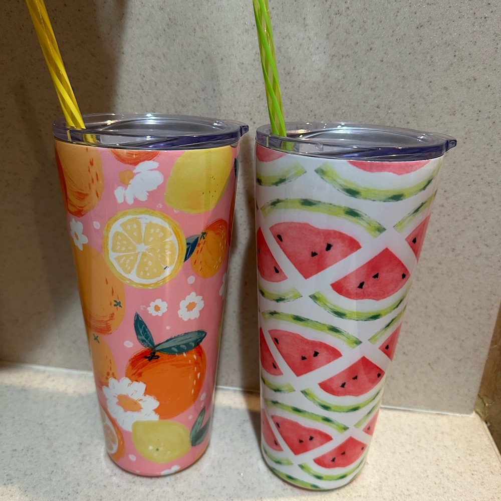2 fruit themed insulated tumblers, lids and straws.